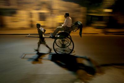 An Indian hand rickshaw puller pulls a passenger early morning in Calcutta. Indian insurance companies need foreign investment if they are to appeal to a more diverse range of clients (Photo: AAP). 