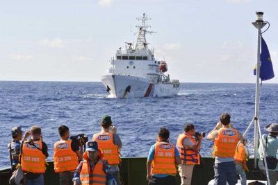 A Chinese government ship trails a Vietnamese Coast Guard vessel with reporters aboard in the South China Sea on July 15, 2014.  (Photo: AAP)