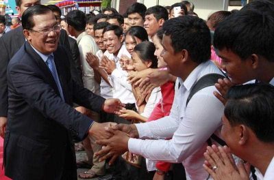 Cambodian Prime Minister Hun Sen, greets well-wishers during the 36th anniversary of Victory Day, when the Khmer Rouge regime was toppled in Phnom Penh, Cambodia, 07 January 2015. (Photo: AAP).