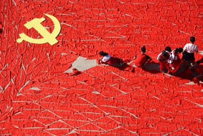 Students use red scarves to make a flag of the Communist Party of China, ahead of the 19th National Congress of the Communist Party, at a primary school in Linyi, Shandong province, China, 13 September 2017. (Photo: Reuters/Stringer).