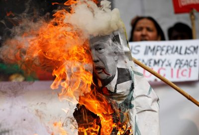 Activists burn an effigy depicting US President Donald Trump during a protest in New Delhi, India, 12 December 2017 (Photo: Reuters/Saumya Khandelwal).