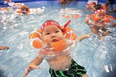 A young Chinese boy takes part in a swimming event in Beijing. Conventional wisdom says that China’s skewed sex ratio is due solely to the one-child policy, but the reality is more complex. (Photo: APP).
