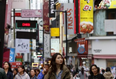 A woman walks in Myeongdong shopping district in Seoul, South Korea, 31 March 2016. (Photo: Reuters/Kim Hong-Ji).