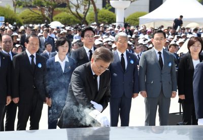 South Korean President Moon Jae-in (C) burns incense during the annual 18 May Democratic Uprising memorial at the Gwangju 18 May National Cemetery in the southwestern city of Gwangju, South Korea, 18 May 2017, as the government holds an annual ceremony to mark the 37th anniversary of a pro-democracy uprising. (Photo: Reuters/Kim Min-hee).