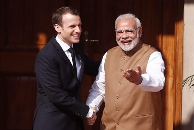 India's Prime Minister Narendra Modi shakes hands with French President Emmanuel Macron as he arrives to attend the International Solar Alliance Founding Conference in New Delhi, India,11 March 2018 (Photo: Reuters/Adnan Abidi).