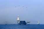 Warships and fighter jets of the Chinese People's Liberation Army (PLA) Navy take part in a military display in the South China Sea, 12 April 2018 (Photo: China Stringer Network via Reuters).