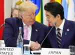 Japan's Prime Minister Shinzo Abe shakes hands with US President Donald Trump during the G20 summit in Osaka, Japan, 28 June 2019 (Photo: Reuters via Sputnik/Mikhail Klimentyev).