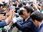 Japanese Prime Minister and leader of the ruling Liberal Democratic Party (LDP) Shinzo Abe shakes hands with his supporters after he delivered a campaign speech for his party candidate Keizo Takemi for the 21 July Upper House election in Tokyo on Sunday, 7 July 2019. (Photo: Yoshio Tsunoda/AFLO).