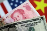 US dollar and Chinese yuan notes are seen in this picture, 2 June 2017 (Photo: Reuters/Thomas White).