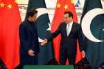 Pakistan's Prime Minister Imran Khan and Chinese Premier Li Keqiang shake hands during a signing ceremony at the Great Hall of the People in Beijing, China, 8 October 2019 (Photo: Reuters/Yukie Nishizawa).