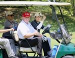 US President Donald Trump sits on a cart as Japanese Prime Minister Shinzo Abe drives the cart as they play golf at Mobara Country Club in Mobara, Chiba prefecture, Japan, 26 May 2019 (Photo: Reuters/Kyodo/Japan's Cabinet Public Relations).