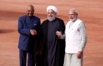 Iranian President Hassan Rouhani (C) holds hands with Indian President Ramnath Kovind (L) and Indian Prime Minister Narendra Modi at Rouhani's ceremonial reception in New Delhi, India, 17 February 2018 (Photo: Reuters/Adnan Abidi).