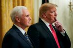 US President Donald Trump stands with US Vice President Mike Pence at the White House in Washington, US, 14 January 2019 (Photo: REUTERS/Joshua Roberts).