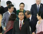 ASEAN Chair and Thai Prime Minister Prayuth Chan-ocho looks ahead as Japan's Prime Minsiter Shinzo Abe, South Korea's President Moon Jae-in and others attend a photo session in Bangkok, Thailand, 3 November 2019 (Photo: Reuters/The Yomiuri Shimbun).