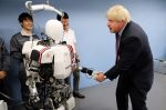 Boris Johnson shakes hands with a humanoid robot Wabian2 at Research Institute for Science and Engineering at Waseda University's Kikuicho Campus in Tokyo, Japan (Photo: Reuters/Eugene Hoshiko/Pool).