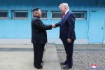 US President Donald Trump shakes hands with North Korean leader Kim Jong Un as they meet at the demilitarized zone separating the two Koreas, in Panmunjom, South Korea, 30 June 2019. (Photo: KCNA via Reuters)
