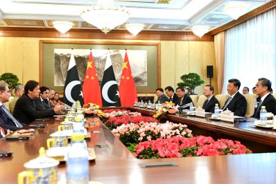 Pakistan's Prime Minister Imran Khan talks to China's President Xi Jinping during their meeting at the Diaoyutai State Guesthouse in Beijing, China, 9 October 2019 (Photo: Reuters/Parker Song).