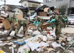 Self-Defense Force officials gather disaster trash in Mito City, Ibaraki Prefecture on 21 October 2019. Typhoon Hagibis, a powerful super typhoon, made a landfall in Japan on 12 October 2019 (Photo: The Yomiuri Shimbun).