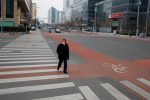 A man wears a face mask as he crosses a street in the Central Business District in Beijing as the country is hit by an outbreak of the novel coronavirus, China 24 February 2020. (Photo: Reuters/Thomas Peter).