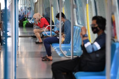 Commuters are seen wearing face masks in an almost empty SBK train as a precaution against the spread of COVID-19 in Kuala Lumpur, Malaysia (Photo: Reuters/Hazim Mohammad).