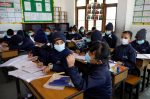Children wearing facial masks, as a precaution after Nepal confirmed the first case of coronavirus in the country, attend a lecture at Matribhumi School in Thimi, Bhaktapur, Nepal, 29 January 2020 (Photo: Reuters/Navesh Chitrakar).