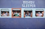 Migrant workers and pilgrims, who were stranded in the western state of Rajasthan due to a lockdown imposed by the government to prevent the spread of coronavirus disease (COVID-19), gesture from inside a train upon their arrival in their home state of eastern West Bengal, at a railway station on the outskirts of Kolkata, India, 5 May, 2020 (Photo: Reuters/Rupak De Chowdhuri).