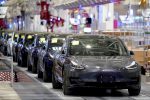 Tesla China-made Model 3 vehicles are seen during a delivery event at its factory in Shanghai, China, 7 January 2020. (Photo: REUTERS/Aly Song).