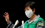 Tokyo Governor Yuriko Koike gestures as she attends a joint news conference with Japan's Economy Minister Yasutoshi Nishimura and other panel members after their talks on the latest situation of the coronavirus disease (COVID-19) outbreak, in Tokyo, Japan, 10 July, 2020. (Reuters/Issei Kato).
