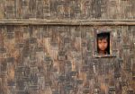 A boy looks from his temporary shelter at a Rohingya refugee camp in Sittwe, Myanmar. (Photo: Reuters/Soe Zeya Tun).