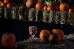 US President Donald Trump is seen between pumpkins during a campaign rally at Pittsburgh-Butler Regional Airport in Butler, Pennsylvania, 31 October 2020 (Photo: Reuters/Carlos Barria).