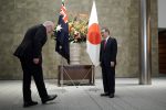 Australian Prime Minister Scott Morrison greets Japan's Prime Minister Yoshihide Suga prior to the official welcome ceremony at Suga's official residence in Tokyo, Japan, 17 November 2020 (Photo: Eugene Hoshiko/Pool via Reuters).