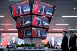 China's President Xi Jinping is seen on screens in the media center as he speaks at the opening ceremony of the third China International Import Expo (CIIE) in Shanghai, China 4 November 2020 (Photo: Reuters/Aly Song).