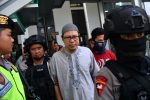 A chief of Jemaah Ansharut Daulah (JAD), the country's largest Islamic State-linked group, arrives for his trial at South Jakarta court in Jakarta, Indonesia, 31 July, 2018 (Photo: Antara Foto/Sigid Kurniawan via Reuters).