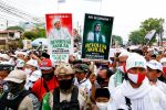 People gather for the homecoming of Rizieq Shihab, the leader of Indonesian Islamic Defenders Front (FPI) who has resided in Saudi Arabia since 2017 in Jakarta, Indonesia, 10 November, 2020 (Photo: Reuters/Ajeng Dinar Ulfiana).