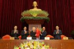 Vietnam's President and General Secretary of the Communist Party Nguyen Phu Trong (3rd L) receives flowers from Prime Minister Nguyen Xuan Phuc after he was re-elected as party chief for a 3rd term during the 13th national congress of the ruling communist party in Hanoi, Vietnam, 31 January 2021. L-R are politburo members Vo Van Thuong, Pham Minh Chinh and Vuong Dinh Hue (Photo:Reuters).