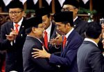 Indonesian President Joko Widodo is congratulated by Prabowo Subianto, who was his former rival in April's election, after his presidential inauguration for the second term at the House of Representatives building in Jakarta, Indonesia, 20 October 2019 (Photo: Reuters/Achmad Ibrahim/Pool).