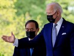 US President Joe Biden escorts Japan's Prime Minister Yoshihide Suga as they arrive for a joint news conference in the Rose Garden at the White House in Washington, US, 16 April, 2021 (Photo: Reuters/Tom Brenner).