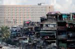 Vitas Tenement, a government housing building, stands with a new residential condominium building seen in the background, 28 May 2018, Tondo, Manila, Philippines (Photo: Reuters/Erik De Castro).