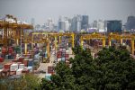 Shipping containers stand at a port in Bangkok, 30 March 2015 (Photo: Reuters/Athit Perawongmetha).