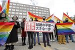 Demonstrators gather outside a district court following a ruling that found government measures against same-sex marriage unconstitutional, Sapporo, Japan, 17 March 2021 (Photo: Reuters/Kyodo).