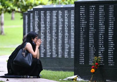 People pray for their family members who died during World War II at the Okinawa Peace Memorial Park on the 75th anniversary of the Battle of Okinawa, Itoman City, Okinawa Prefecture, Japan, 23 June, 2020 (Photo: The Yomiuri Shimbun via Reuters).