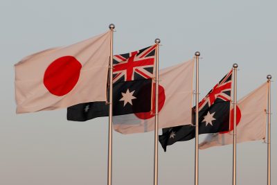 Japanese and Australian flags are pictured before the arrival of Australian Prime Minister Scott Morrison at Haneda airport in Tokyo, Japan 17 November 2020 (Photo: Reuters/Issei Kato).