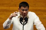 Philippine President Rodrigo Duterte gestures as he delivers his 6th State of the Nation Address (SONA), at the House of Representative in Quezon City, Metro Manila, Philippines, 26 July 2021 (Photo: Reuters/Lisa Marie David).