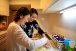 Lesbian couple Jenny and Narumi cook together at Jenny's parents' house in Tokyo, Japan, 19 March 2021 (Photo: Akira Tomoshige/Reuters).