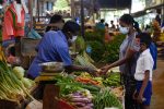 A Sri Lankan customer buys vegetables in the Nugegoda retail vegetable market near Colombo, Sri Lanka. Sri Lanka. 16 December 2021 (Akila Jayawardana/NurPhoto via Reuters Connect).