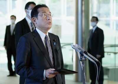 Japanese Prime Minister Fumio Kishida speaks to reporters at the premier's office in Tokyo on 2 December 2021 (Photo: Kyodo via Reuters).