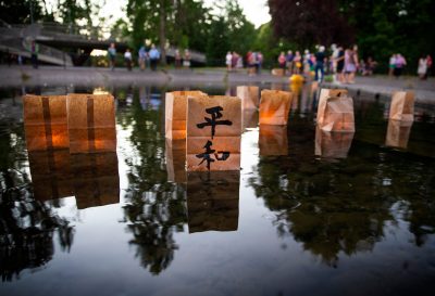 Candle lanterns float on the water of a pond at Alton Baker Park at the conclusion of the annual Hiroshima-Nagasaki. (Photo: REUTERS/USA Today Network).