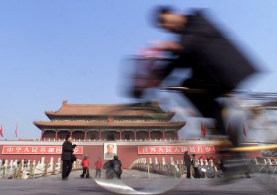A cyclist rides past Tiananmen Gate in Beijing on 19 February, 2002. U.S. President George W. Bush visited China's capital on 21 February 2002, 30 years to the day after former president Richard Nixon's trip to China ended two decades of open hostility. (Photo: REUTERS/Guang Niu GN/RCS)