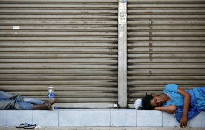Homeless people sleep on a street in Kuala Lumpur, Malaysia, November 30, 2008. (Photo: Reuters/Bazuki Muhammad).