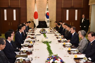 Korean president Moon Jae-in and former Japanese Prime Minister Shinzo Abe hold their luncheon meeting in Tokyo, Japan 9 May 2018 (PHOTO: Kazuhiro Nogi/Pool via Reuters)